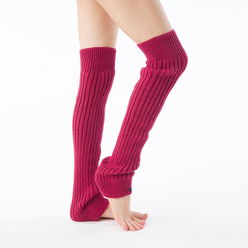 Side view of a woman's leg wearing the MAGENTA color of the Knitido plus brand Wool Blend Ribbed Leg Warmer product