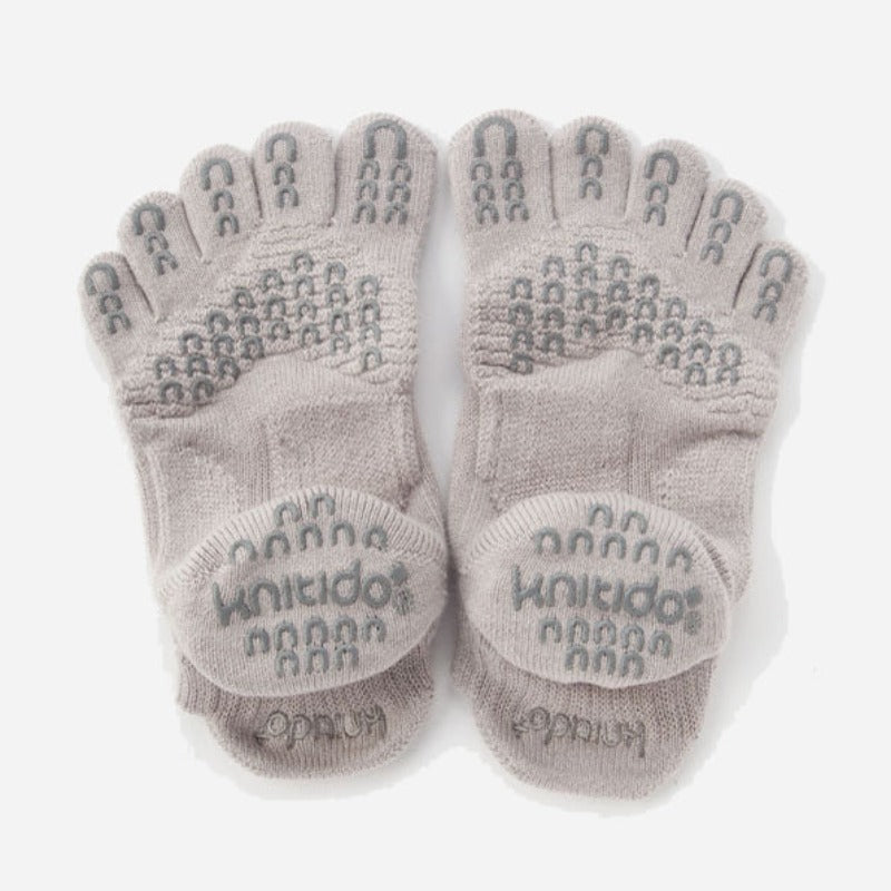 Backside of Knitido plus brand Basic Solid Colors Footie Grip Toe Socks With Power Pads in grey, viewed from flat