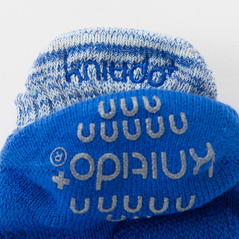 Close-up of the blue heel portion of the Knitido plus brand Heather Footie Grip Toe Socks With *Power Pads*.