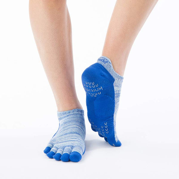 Legs wearing Knitido plus brand Heather Footie Grip Toe Socks With *Power Pads* in BLUE color, front view
